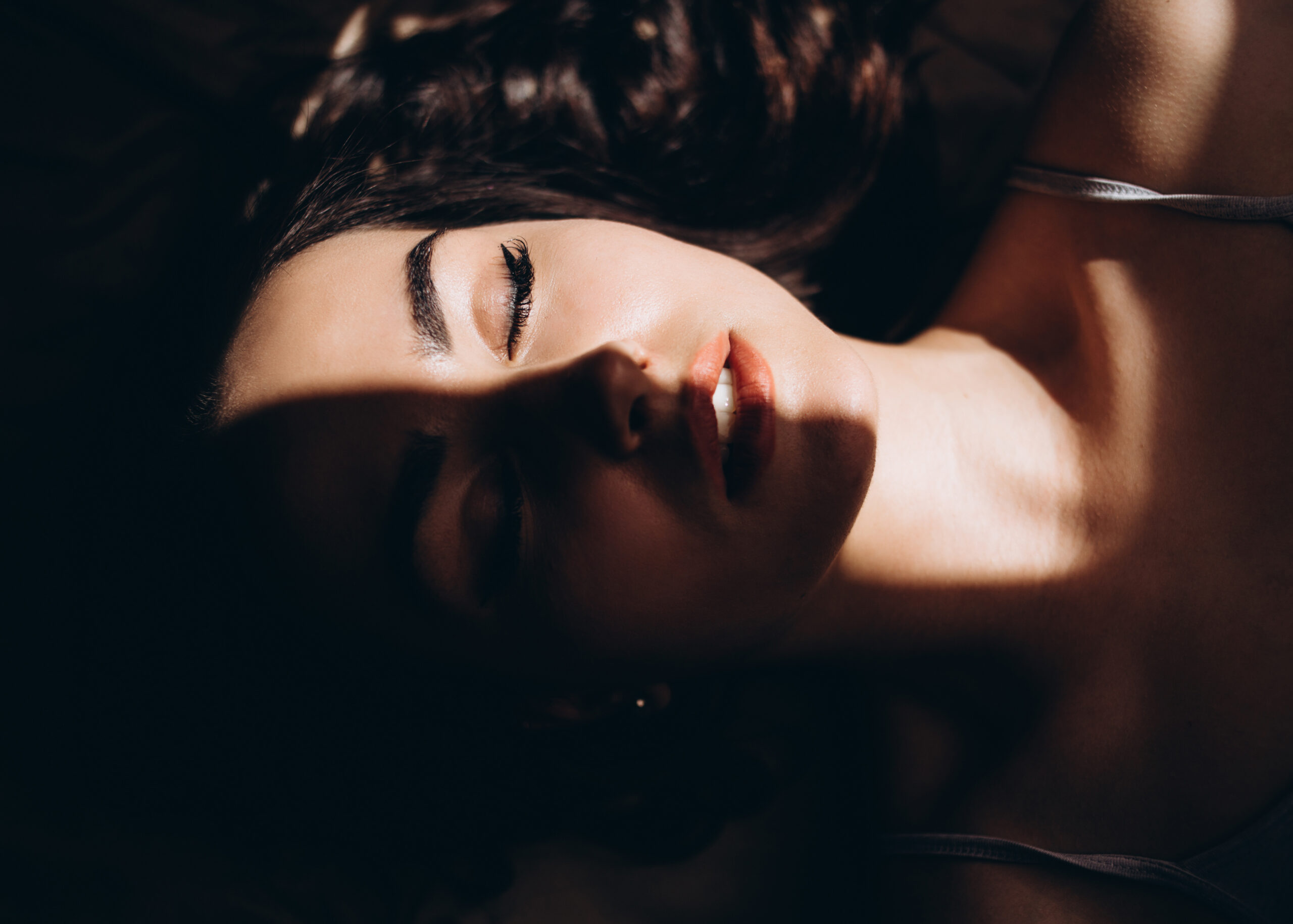 the charming girl lies on the bed